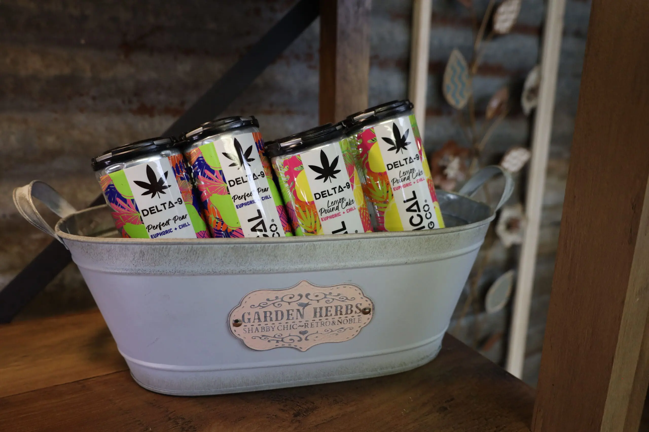 Cans of Botanical Brewing delta 9 THC drinks in an ice pail
