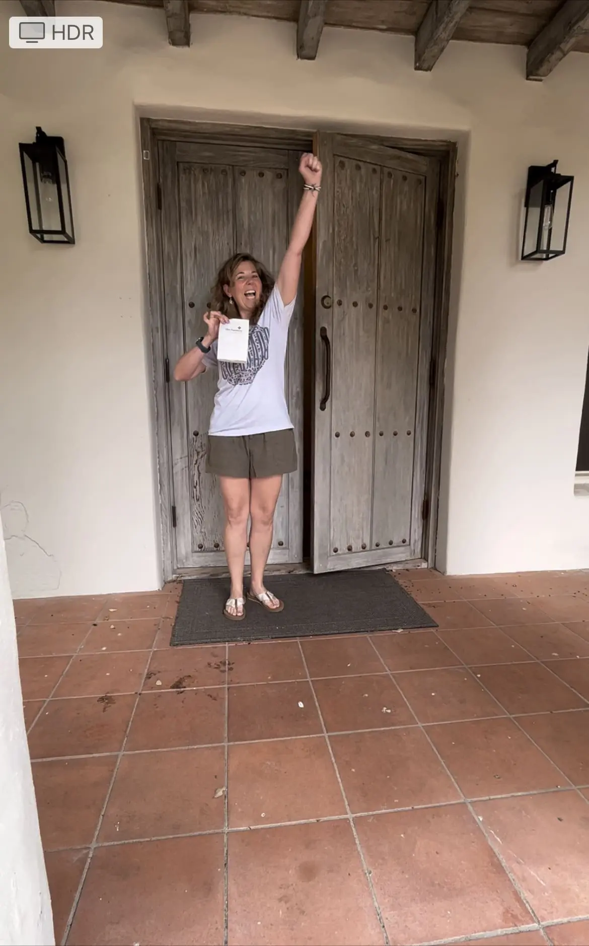Excited customer receiving a delivery from The Farmacy Botanical Shoppe