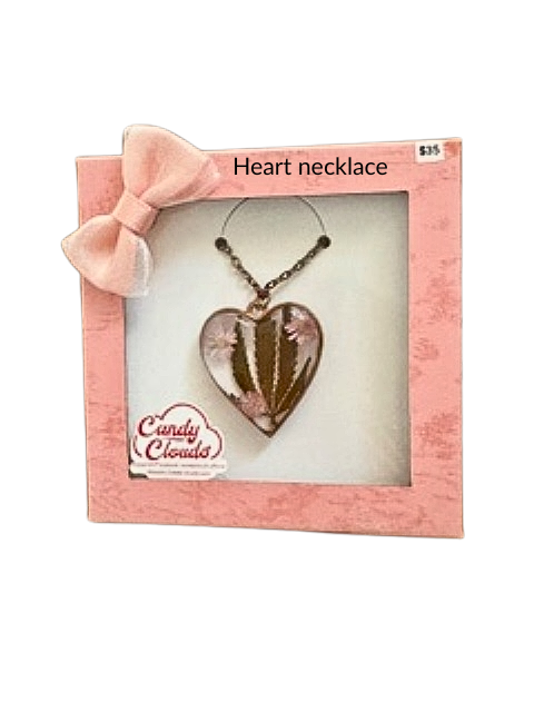 Handmade heart-shaped resin necklace with hemp leaf and flower