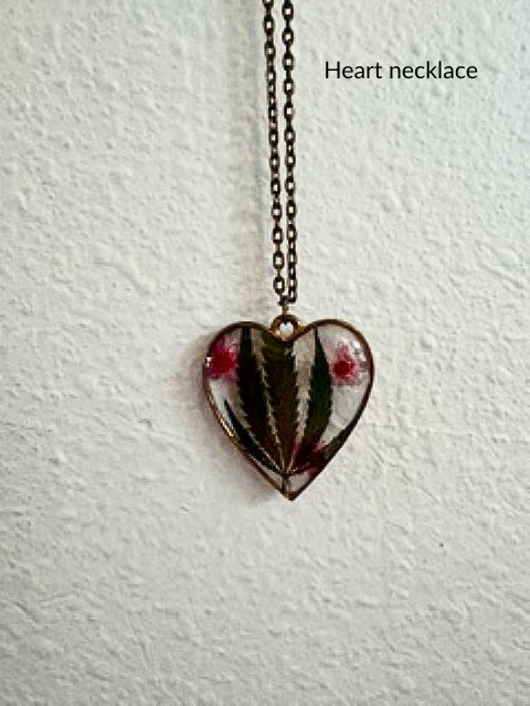 Handmade heart-shaped resin necklace with hemp leaf and flower