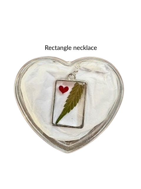 Handmade rectangle resin necklace with hemp leaf and pink heart