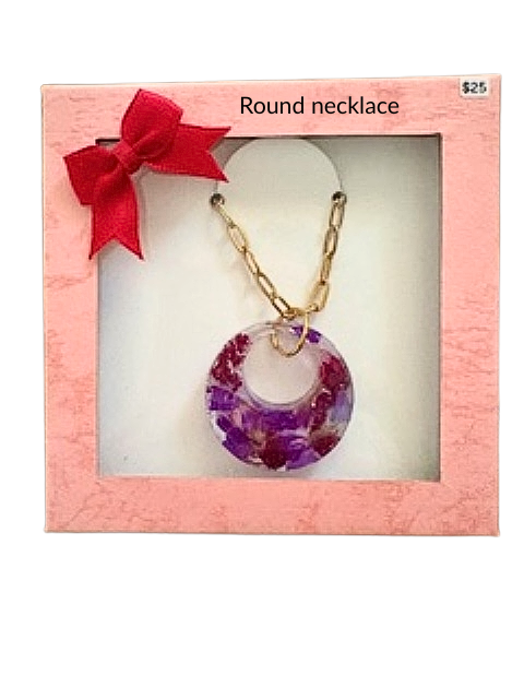Handmade round resin necklace with purple flowers