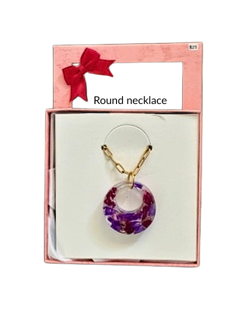Handmade round resin necklace with purple flowers